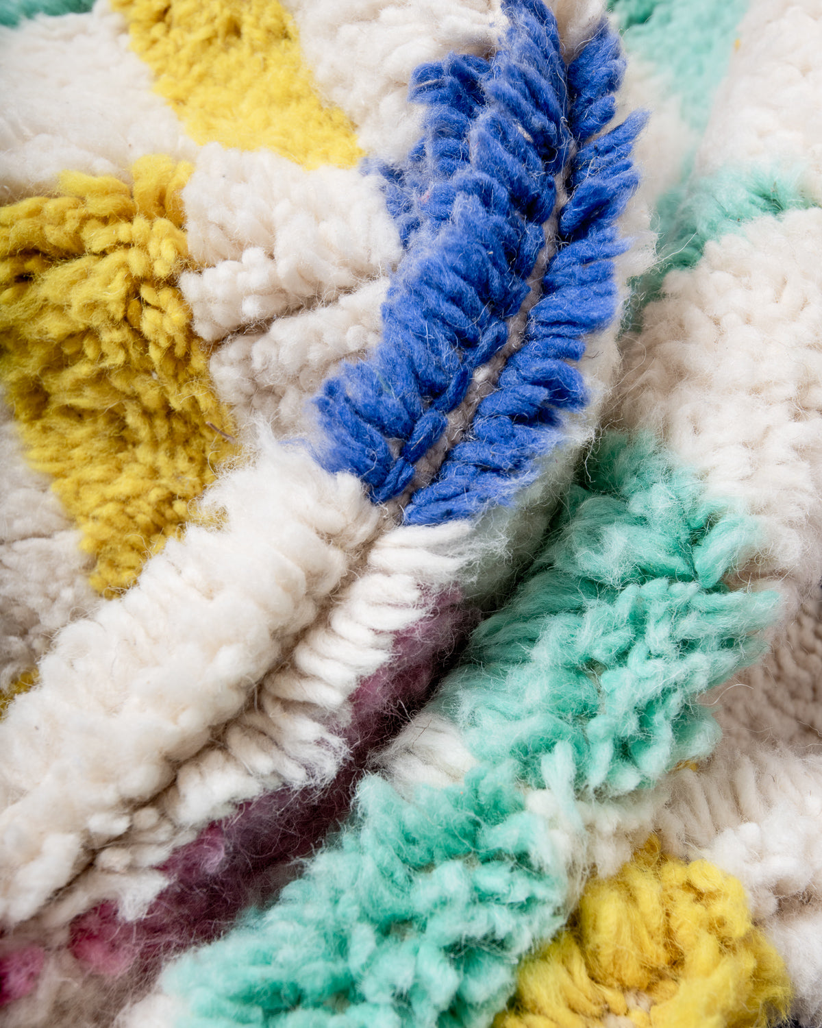 Modern, designer, handcrafted Berber rug from Morocco. Beniourain carpet with beautiful colours and patterns and fluffy wool texture.